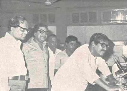Scientists at Microscope